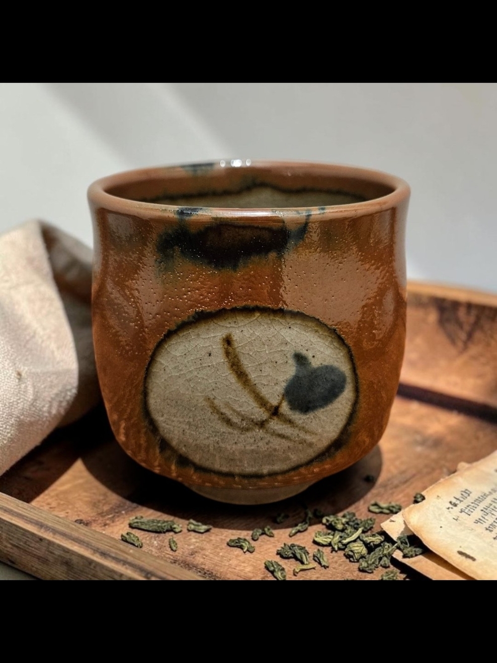 Handcrafted Brown Glazed Ceramic Cup with Decorative Motif